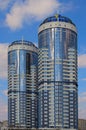 Residential complex Sunny riviera. Text on roof-UKRBUD. Two modern luxury skyscrapers against sky Royalty Free Stock Photo